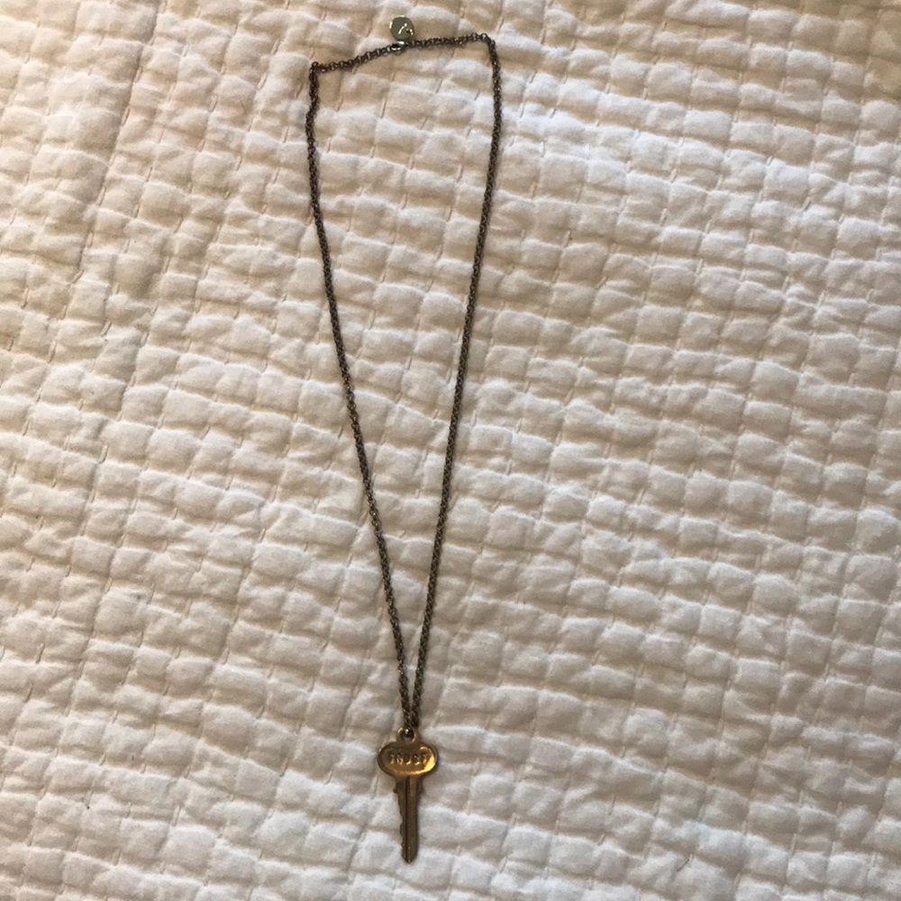 Costume jewelry with “key” ornament